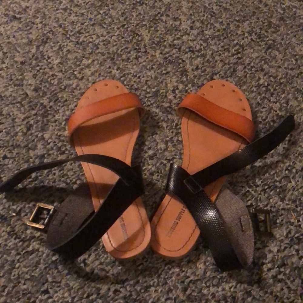 Tan and black sandals